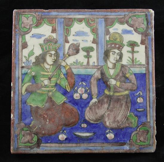 A Persian Qajar dynasty moulded polychrome pottery tile, 23cm x 23cm